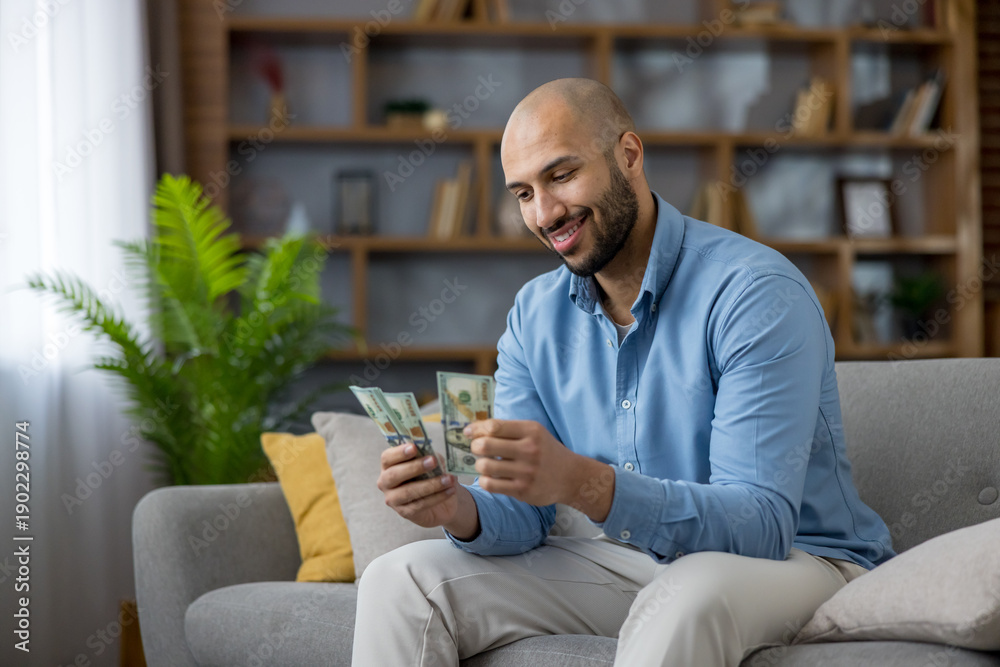 A person calmly reviewing their finances at home.